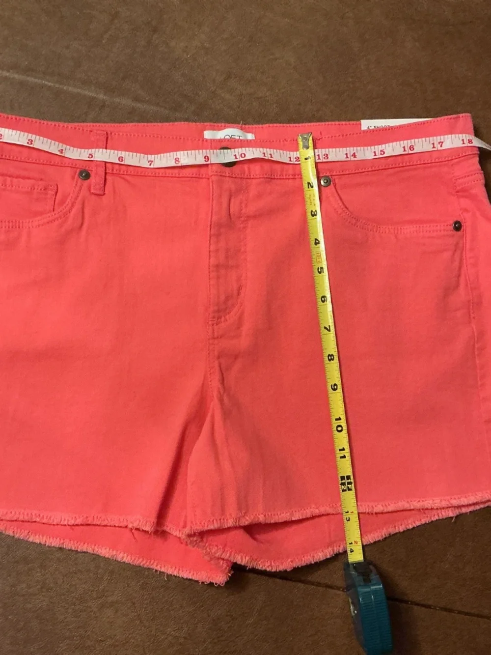 Loft 4” women”s shorts mid rise 98% cotton, 2% spandex. Size 10, coral color.